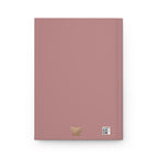 Pink notebook with a gold logo and QR code on a white background
