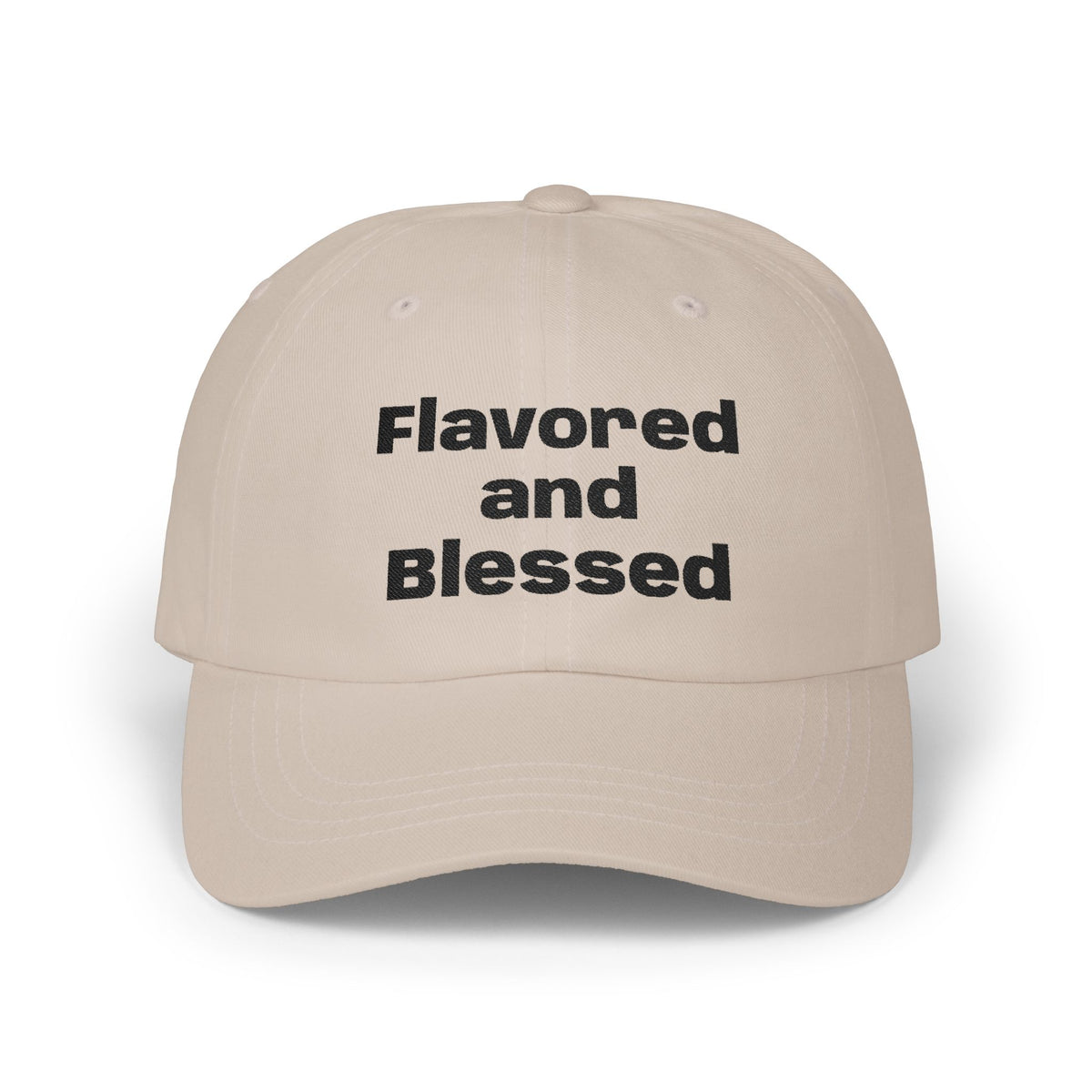 Beige cap with 'Flavored and Blessed' text on a white background