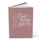 Pink notebook with motivational text on a white background