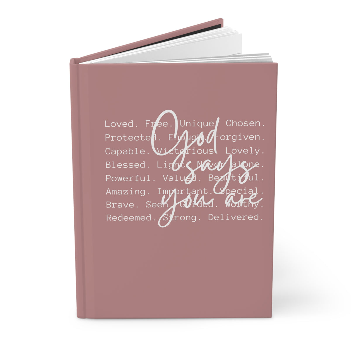Pink notebook with motivational text on a white background