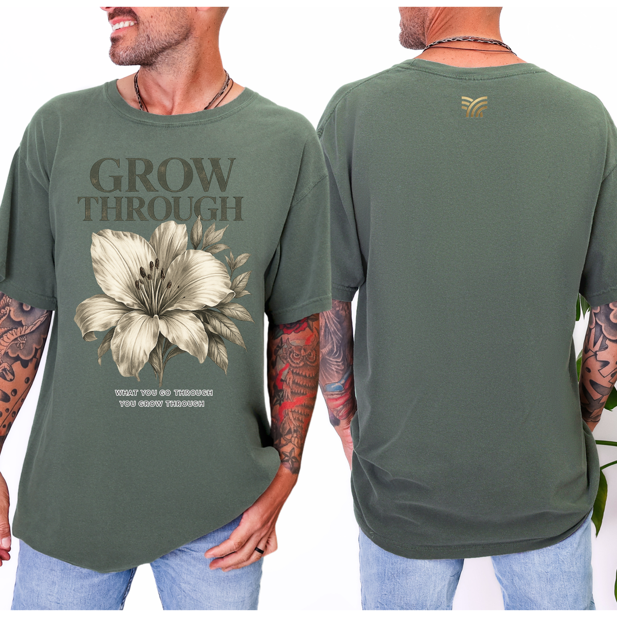 Green t-shirt with floral design and text 'Grow Through' on front, worn by a person.