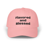 Pink cap with 'Flavored and Blessed' text on a white background