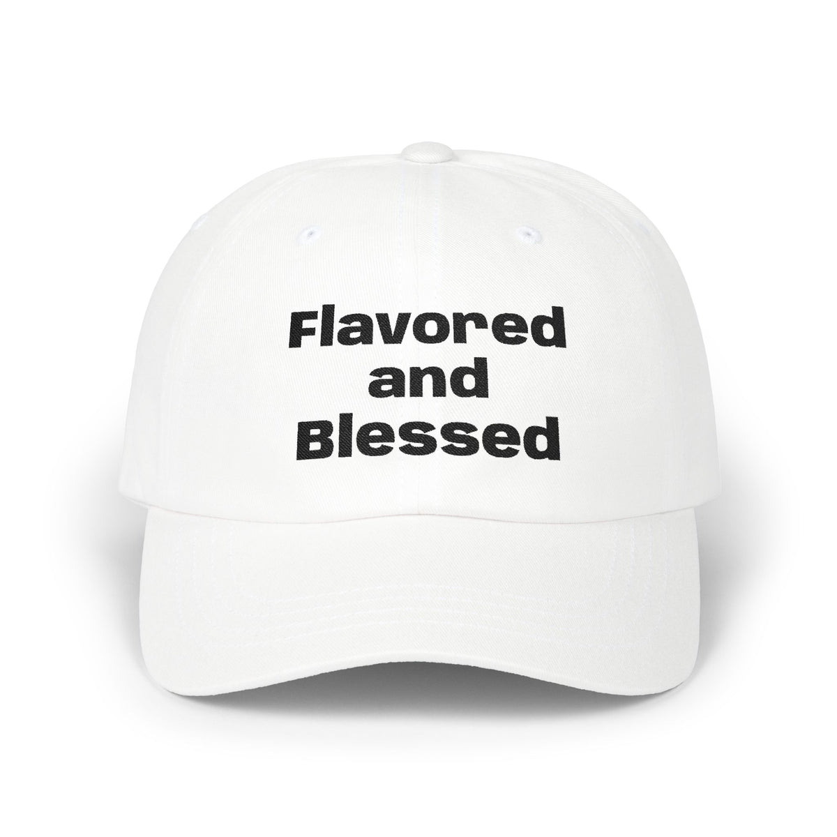White cap with 'Flavored and Blessed' text on a white background